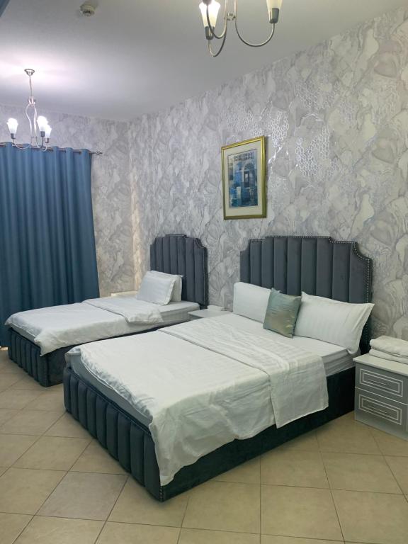 Postel nebo postele na pokoji v ubytování Jin Jie Residence