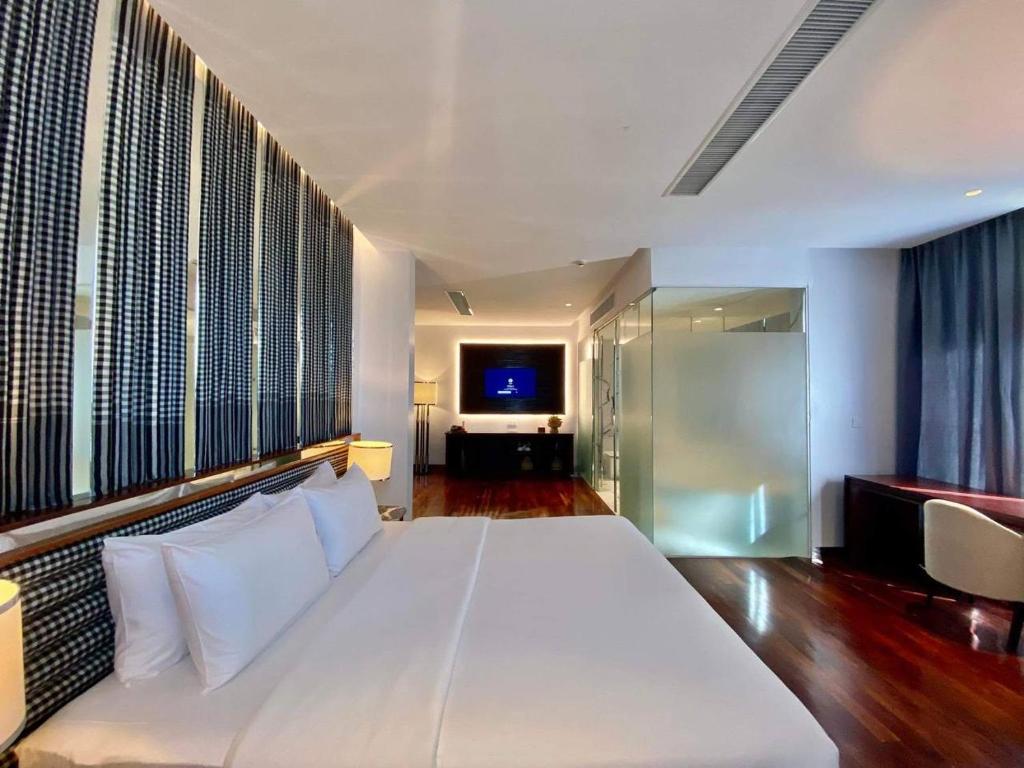 Postel nebo postele na pokoji v ubytování UTEY Hotel