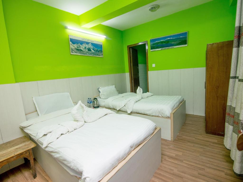 Postel nebo postele na pokoji v ubytování Hotel Pomelo House
