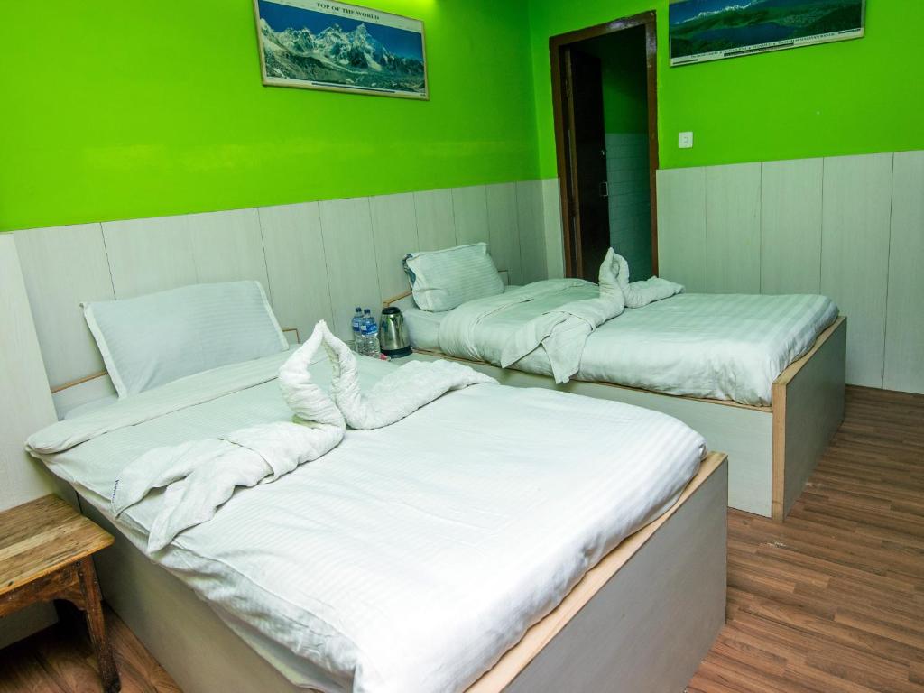 Postel nebo postele na pokoji v ubytování Hotel Pomelo House