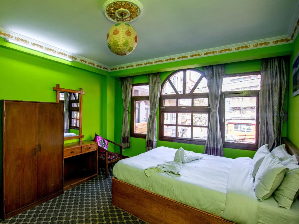 Postel nebo postele na pokoji v ubytování Hotel Pomelo House