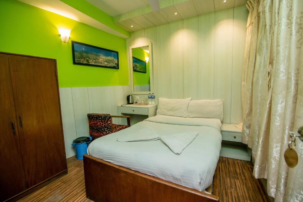 Postel nebo postele na pokoji v ubytování Hotel Pomelo House