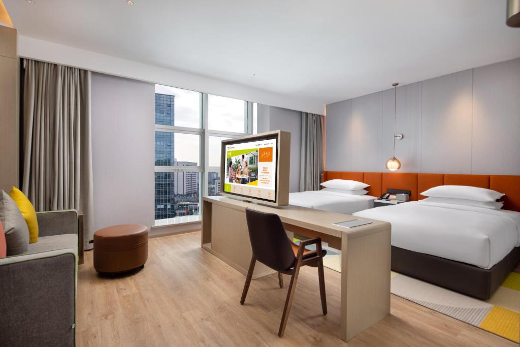 Postel nebo postele na pokoji v ubytování Home2 Suites by Hilton Chongqing Yubei