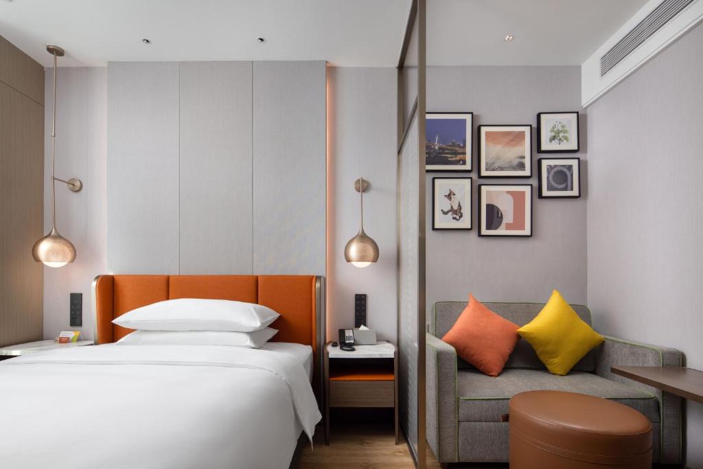 Postel nebo postele na pokoji v ubytování Home2 Suites by Hilton Chongqing Yubei
