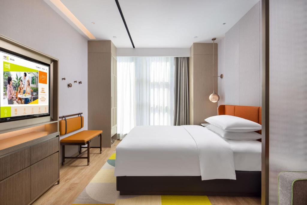 Postel nebo postele na pokoji v ubytování Home2 Suites by Hilton Chongqing Yubei