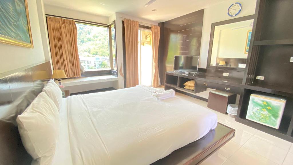 Postel nebo postele na pokoji v ubytování SM Patong Resort