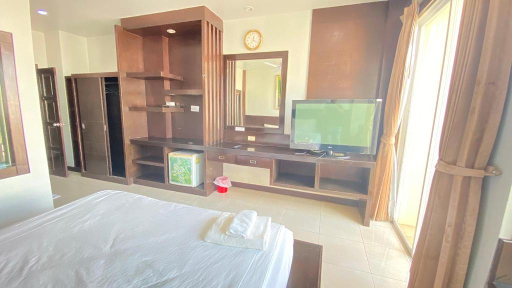 Postel nebo postele na pokoji v ubytování SM Patong Resort
