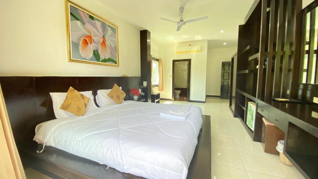 Postel nebo postele na pokoji v ubytování SM Patong Resort