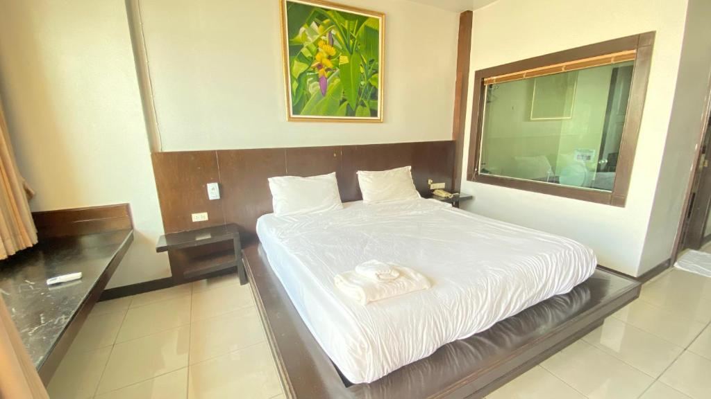 Postel nebo postele na pokoji v ubytování SM Patong Resort