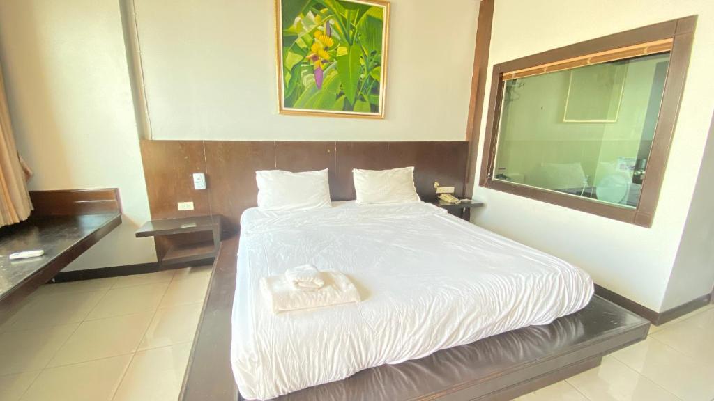 Postel nebo postele na pokoji v ubytování SM Patong Resort
