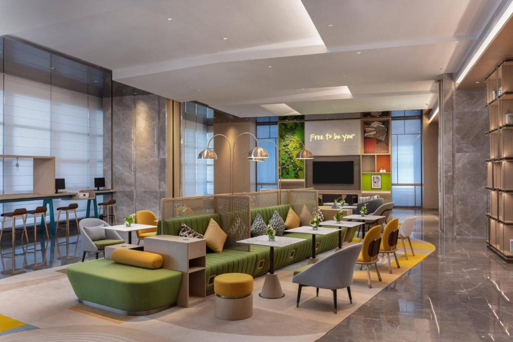 TV a/nebo společenská místnost v ubytování Home2 Suites by Hilton Guiyang Airport