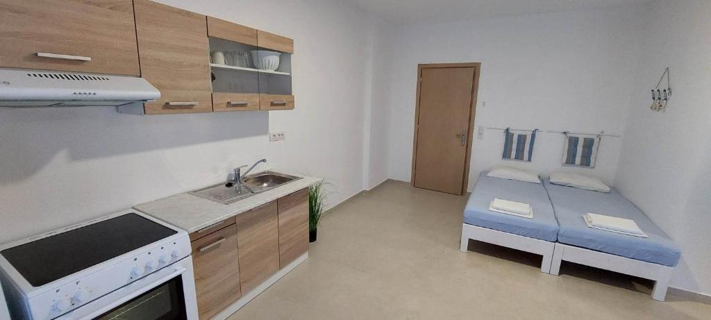 Postel nebo postele na pokoji v ubytování Telhinis Hotel & Apartments