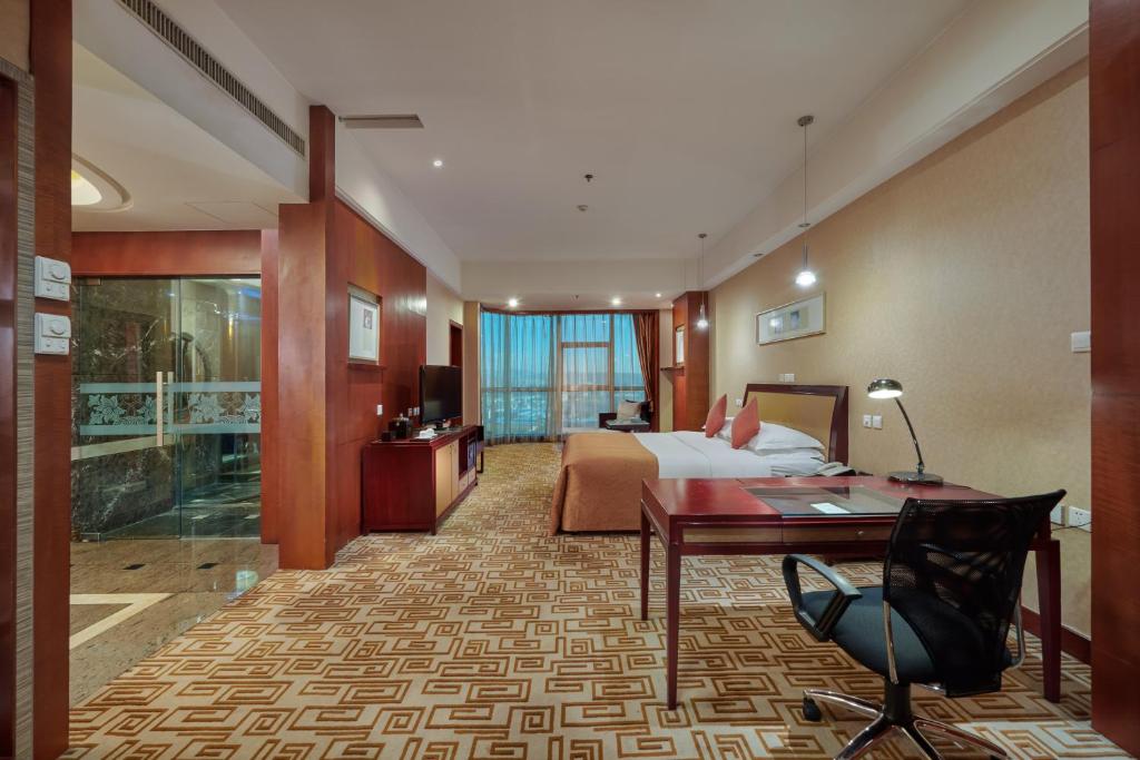 Postel nebo postele na pokoji v ubytování Empark Grand Hotel Kunming