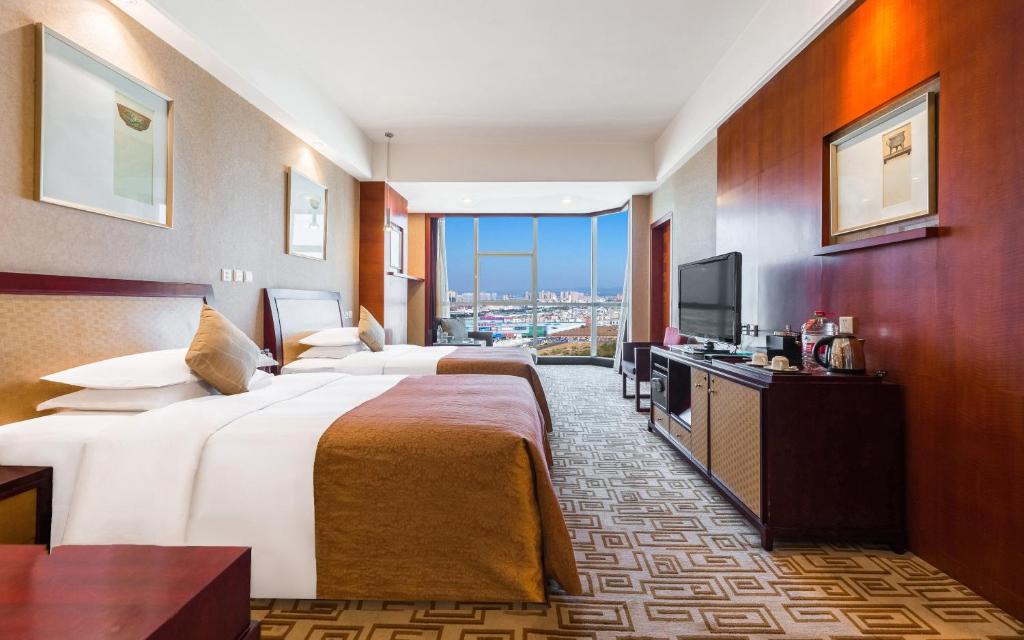 Postel nebo postele na pokoji v ubytování Empark Grand Hotel Kunming