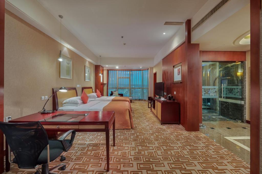Postel nebo postele na pokoji v ubytování Empark Grand Hotel Kunming
