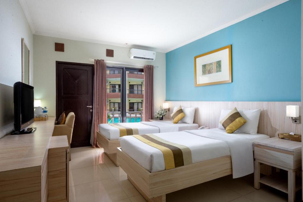 Postel nebo postele na pokoji v ubytování Palace Hotel