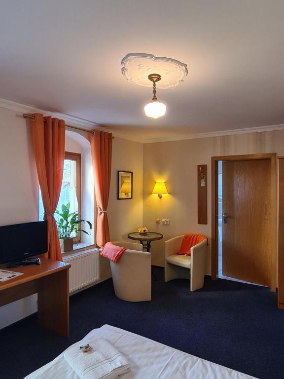 TV a/nebo společenská místnost v ubytování Hotel Brauhaus Wittenberg