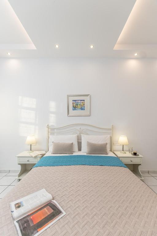 Postel nebo postele na pokoji v ubytování Zanneta Apartments & Suites
