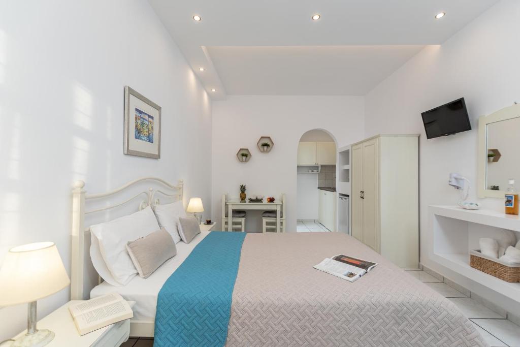 Postel nebo postele na pokoji v ubytování Zanneta Apartments & Suites