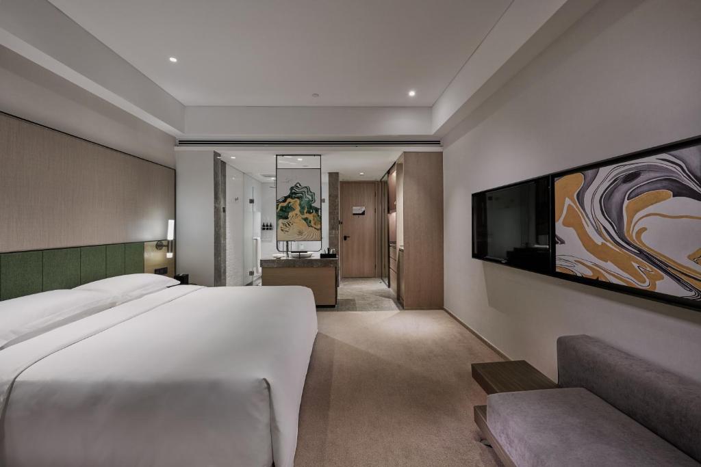Postel nebo postele na pokoji v ubytování Empark Grand Hotel Kunming
