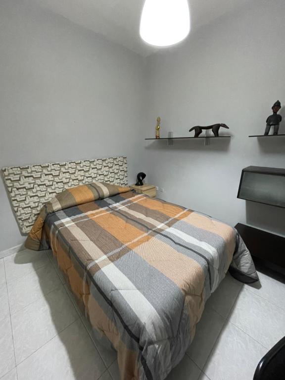 A bed or beds in a room at Merola Sisters Holiday Home