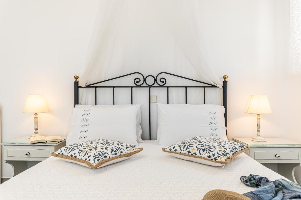 Postel nebo postele na pokoji v ubytování Zanneta Apartments & Suites