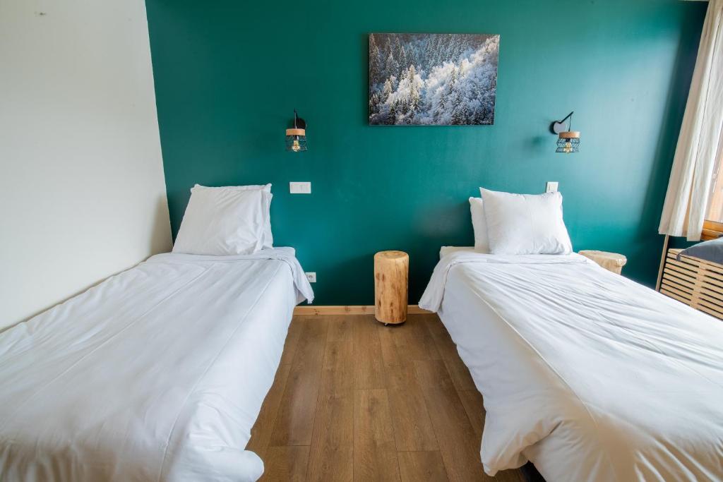 Postel nebo postele na pokoji v ubytování Hotel Les Lutins