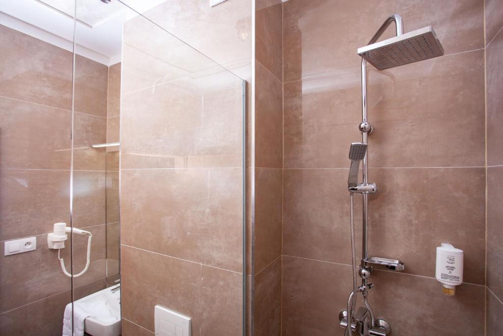 a bathroom with a shower with a glass door at Villa Dunaj in Dunajská Streda