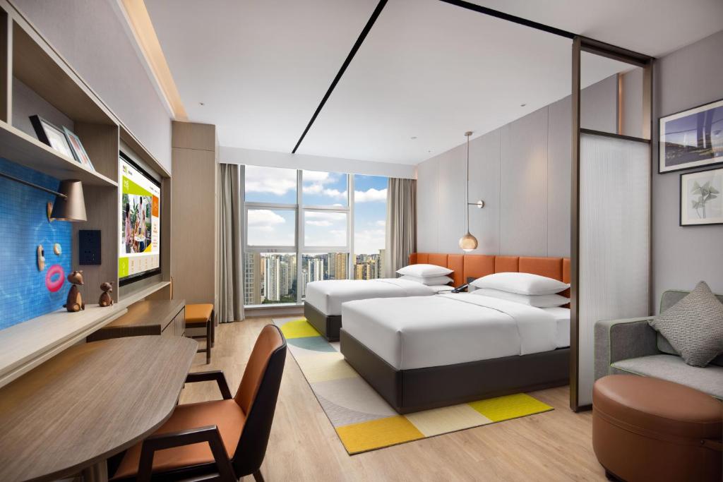 Postel nebo postele na pokoji v ubytování Home2 Suites By Hilton Wuhan Xudong