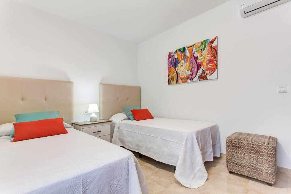 Postel nebo postele na pokoji v ubytování Homu Aura Fantástica villa con piscina privada