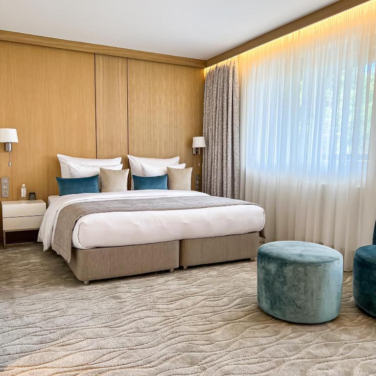 Posteľ alebo postele v izbe v ubytovaní Normafa Hotel & Retreat