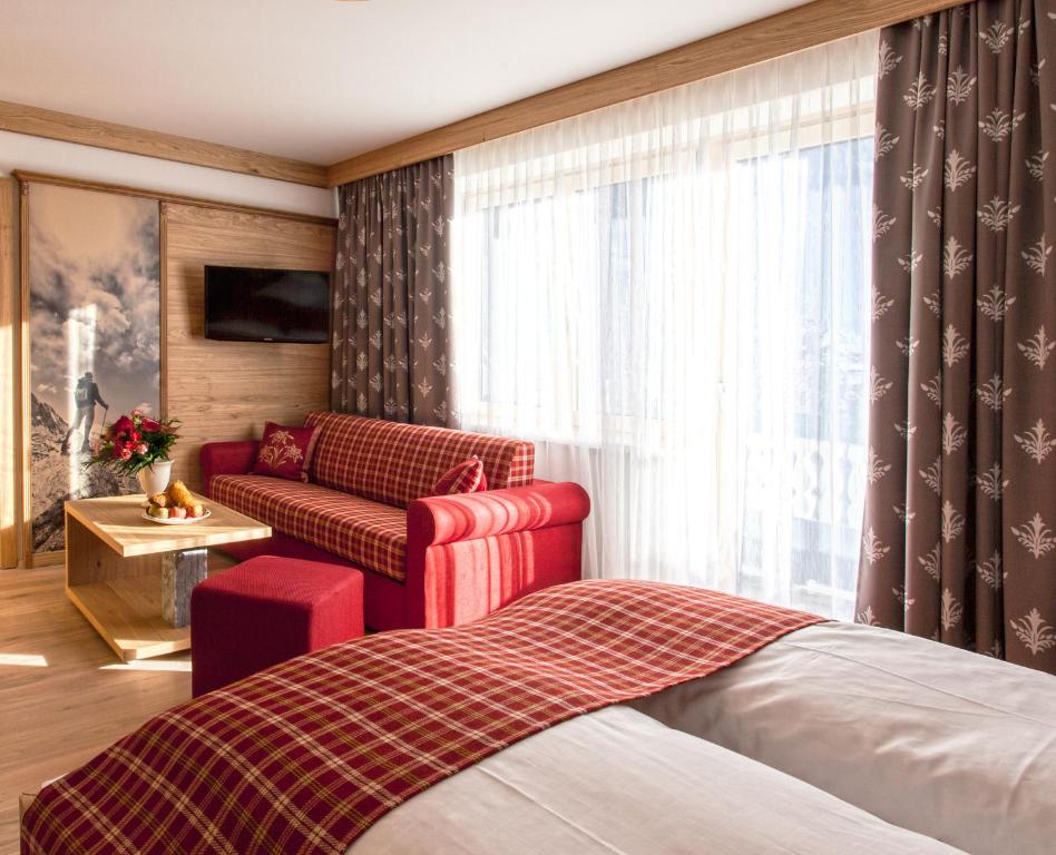 Postel nebo postele na pokoji v ubytování Hotel Zum Stern - Bergbahnen inklusive im Sommer 2025