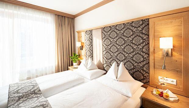 Postel nebo postele na pokoji v ubytování Hotel Zum Stern - Bergbahnen inklusive im Sommer 2025