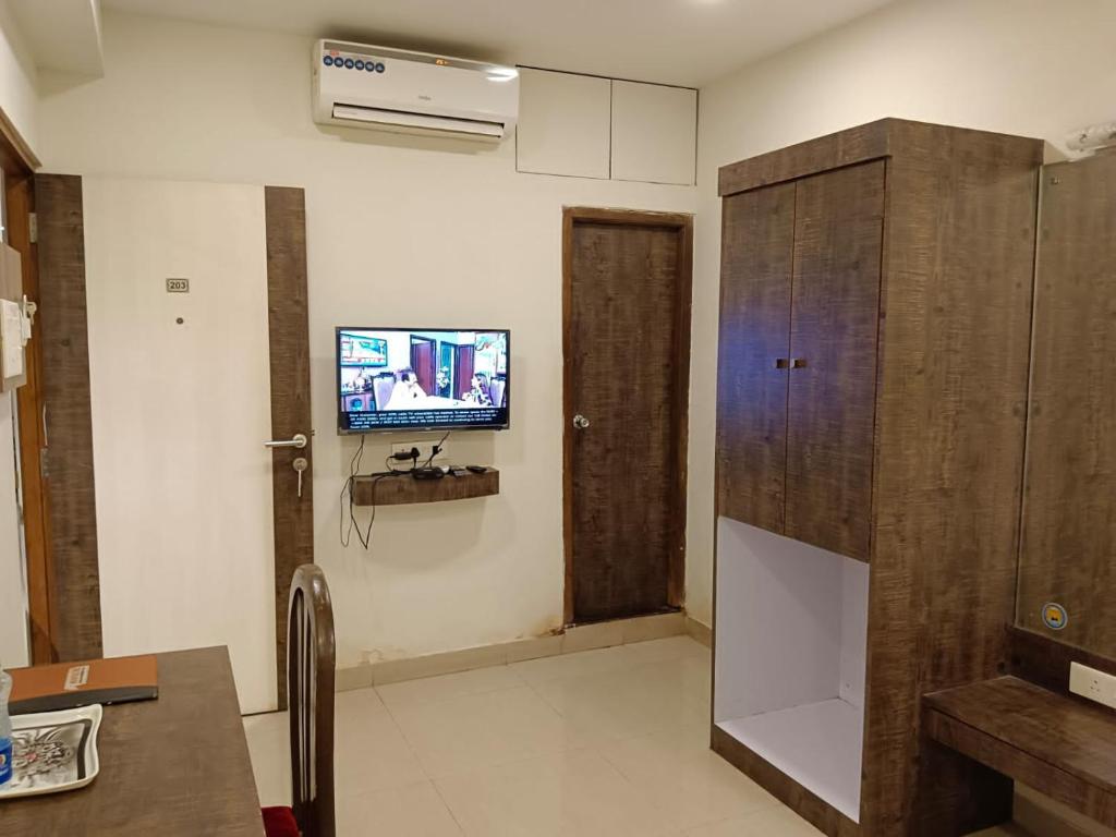 TV a/nebo společenská místnost v ubytování Boshan Hotels