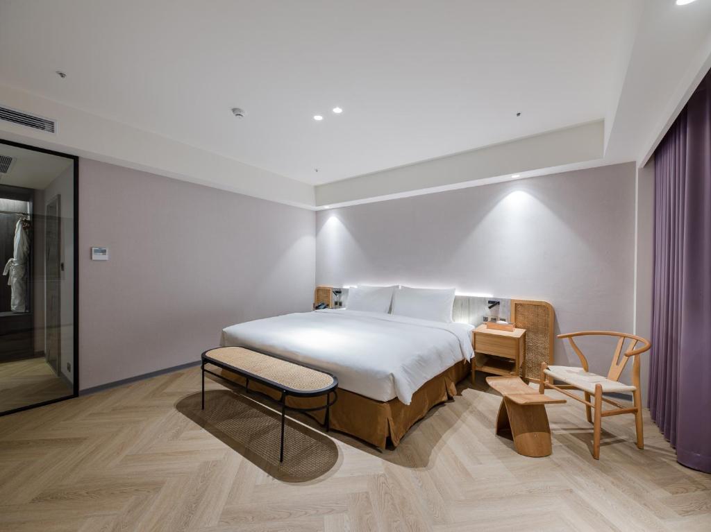 Postel nebo postele na pokoji v ubytování Dahu Park Hotel