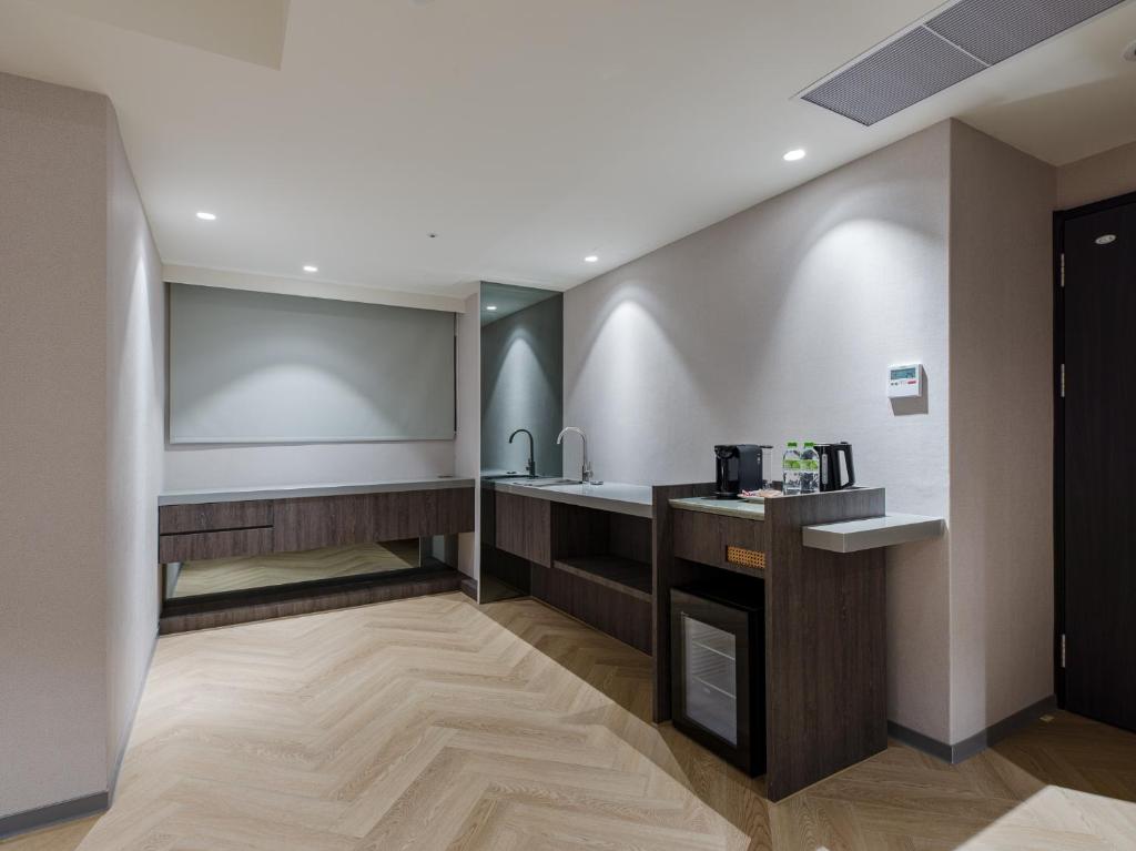 Kuchyň nebo kuchyňský kout v ubytování Dahu Park Hotel