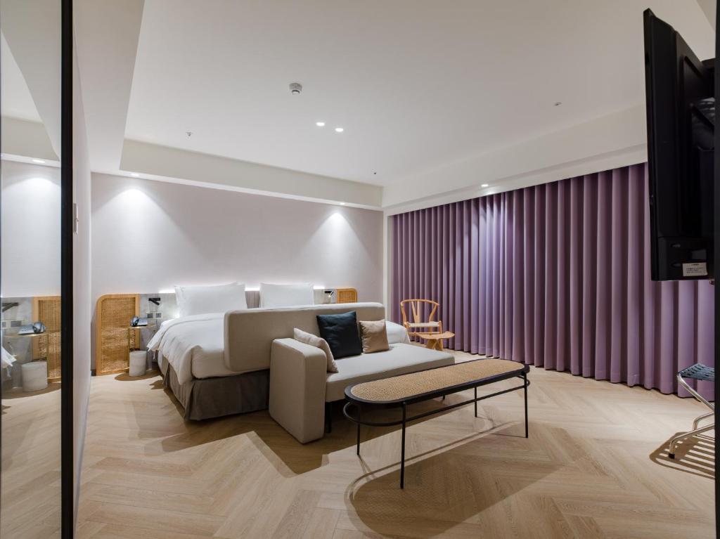 Postel nebo postele na pokoji v ubytování Dahu Park Hotel