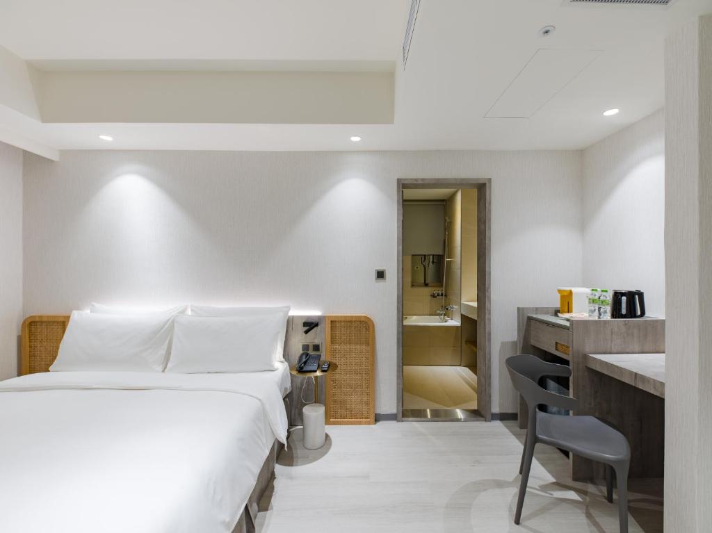 Postel nebo postele na pokoji v ubytování Dahu Park Hotel