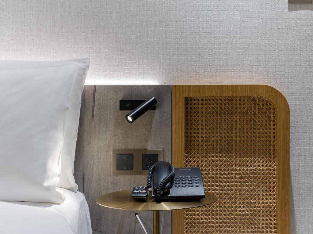 Postel nebo postele na pokoji v ubytování Dahu Park Hotel
