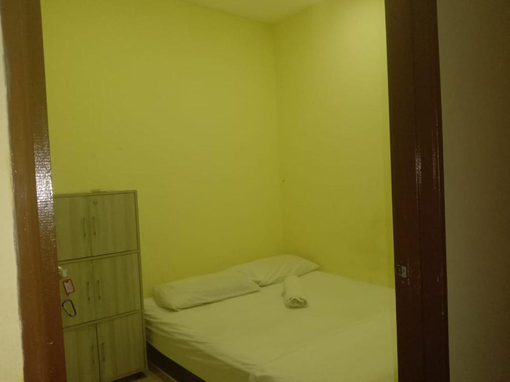 Postel nebo postele na pokoji v ubytování RAS Hotel