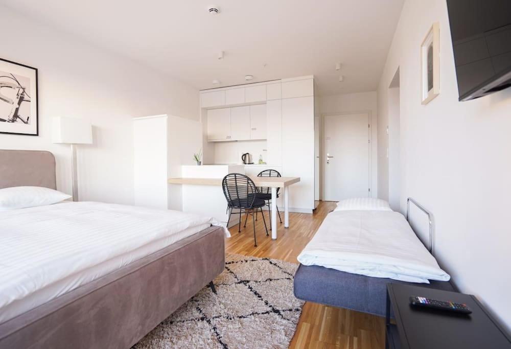 A bed or beds in a room at Fine Studio with terrace - 15 Min to Center
