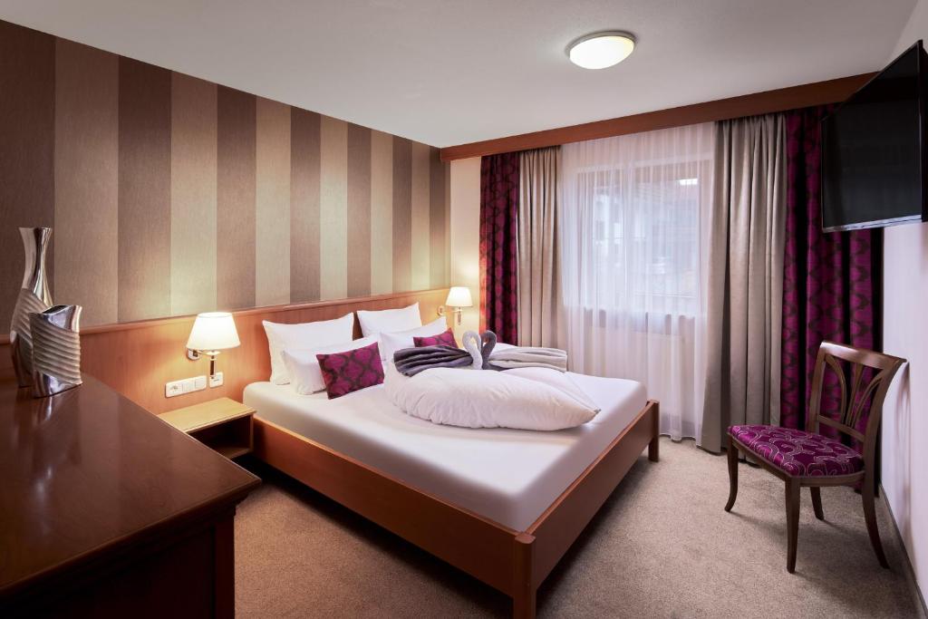 Postel nebo postele na pokoji v ubytování Maximilian Appartements