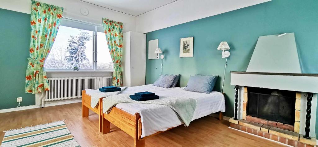 Postel nebo postele na pokoji v ubytování Kronlund Kursgård