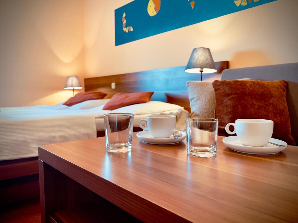 Postel nebo postele na pokoji v ubytování Hotel Sluníčko
