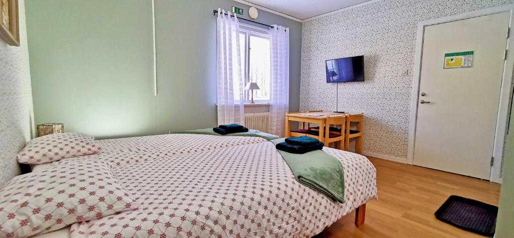 Postel nebo postele na pokoji v ubytování Kronlund Kursgård