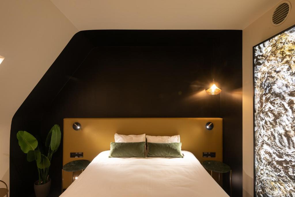 Postel nebo postele na pokoji v ubytování Ariane Hotel