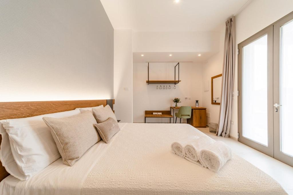 Postel nebo postele na pokoji v ubytování Sarmenti Agriresort