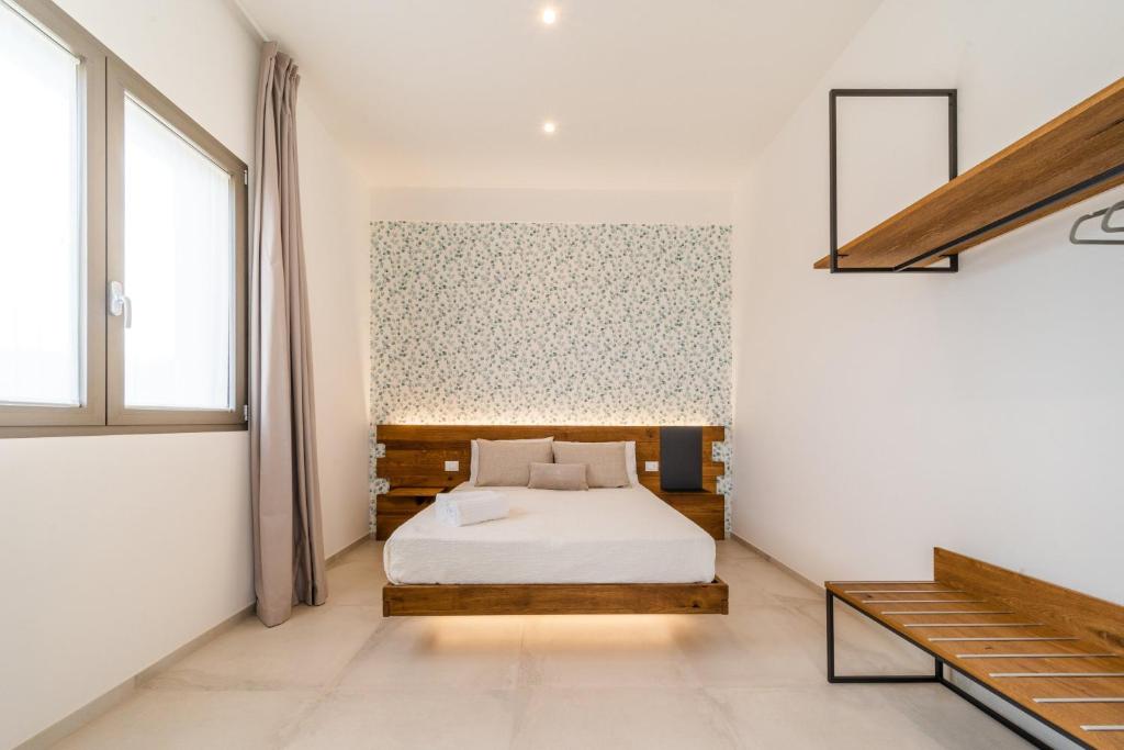 Postel nebo postele na pokoji v ubytování Sarmenti Agriresort