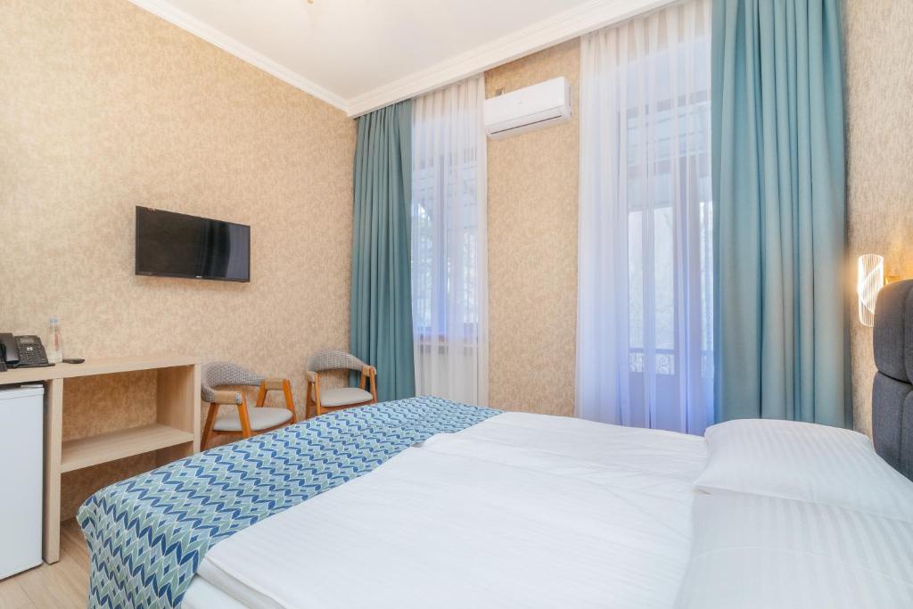 TV a/nebo společenská místnost v ubytování MY HOTEL