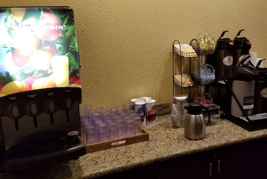 a counter top with a bunch of items on it at Ramada by Wyndham Houston Intercontinental Airport East in Humble